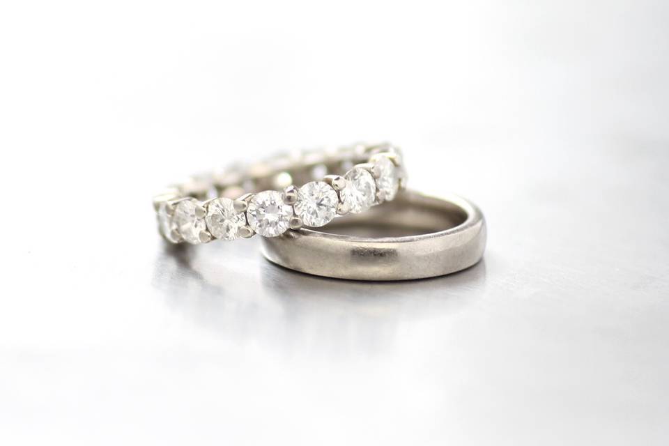 4 carat white diamond eternity band with matching 18k white palladium mix wedding band.