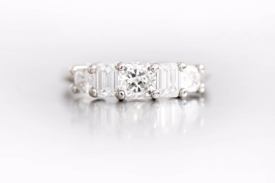 18k white gold engagement ring with alternating cushion and emerald cut diamonds