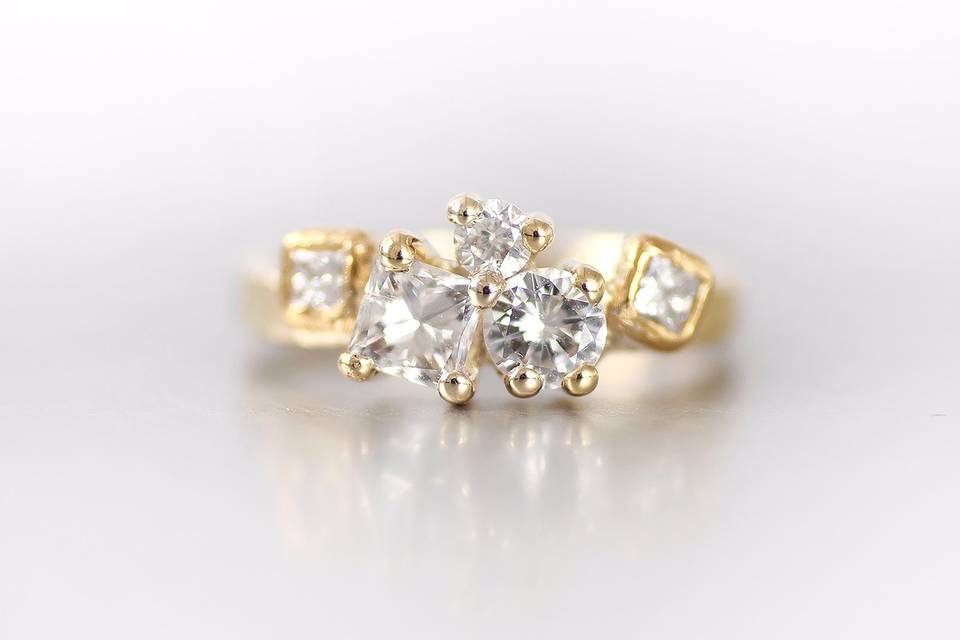 Yellow gold redesigned engagement ring with existing diamonds plus mother's stone.