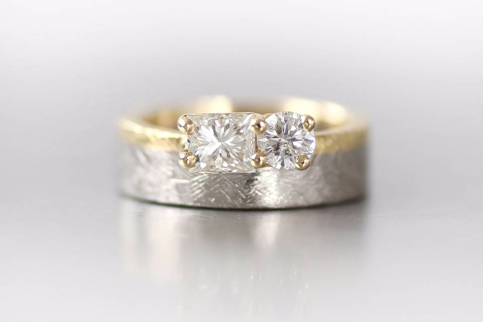 Palladium and yellow gold ring with offset radiant and round diamond