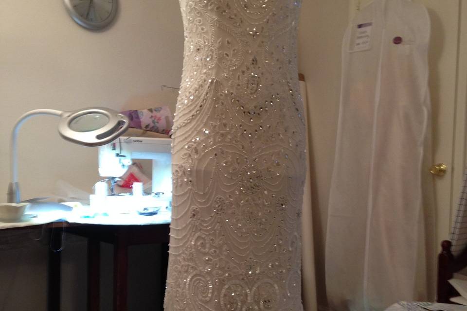 Dress mast be shorten on hip and hem.