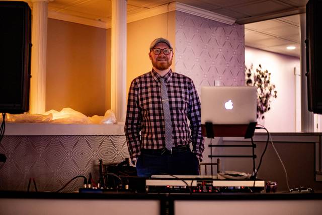 DJ Adam Robb at the booth