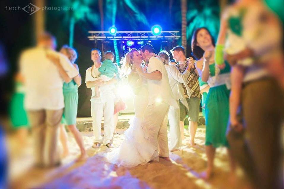 Newlyweds and guests dancing