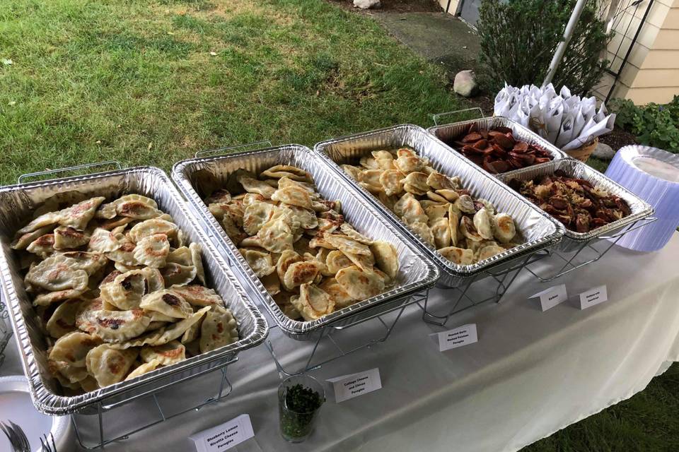 Authentic Pierogis bar, roasted garlic mashed potatoes pierogis, cottage cheese and chives pierogis, and blubbery lemon with ricotta cheese pierogis.  Kielbasa with or without sour kraut.