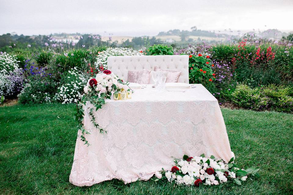Romantic sweetheart table with love seat