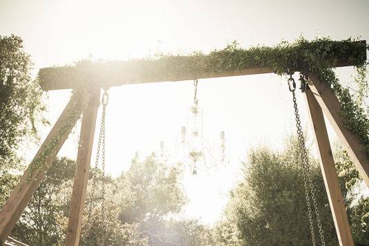 Love seat swing and chandelier out door wedding reception