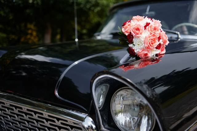 Townline Road Events. A wedding floral arrangement on the hood of a classic black car in New Buffalo, Michigan.jpeg
