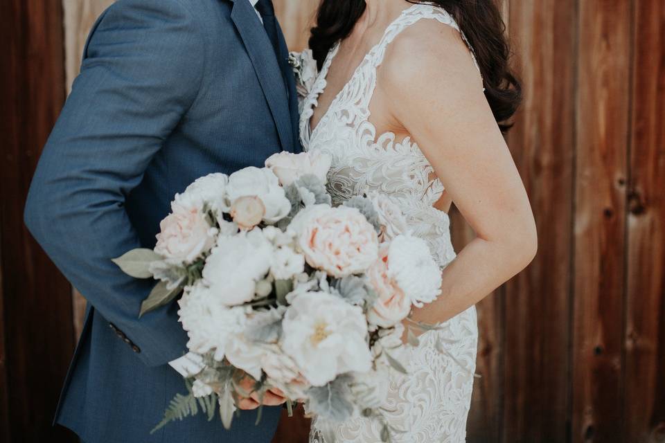 Couple kissing with Bouquet