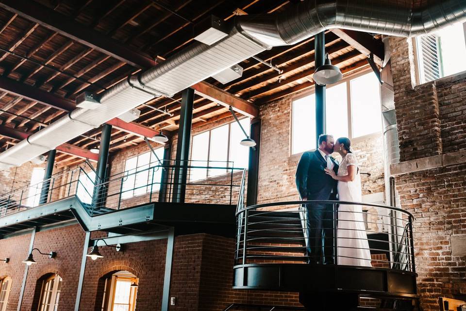 Newlyweds on the spiral stairs