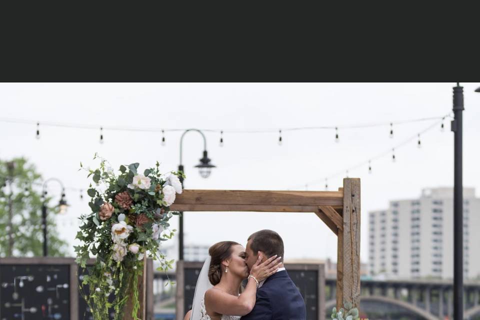 Newlyweds sharing a kiss