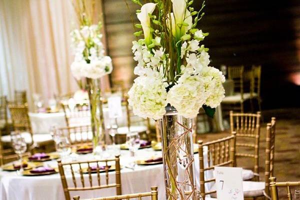 Table setting and raised floral centerpiece