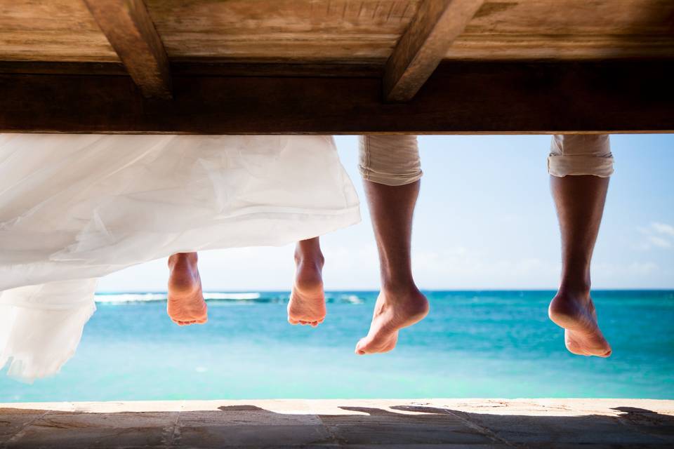 Newlyweds on beach cabana