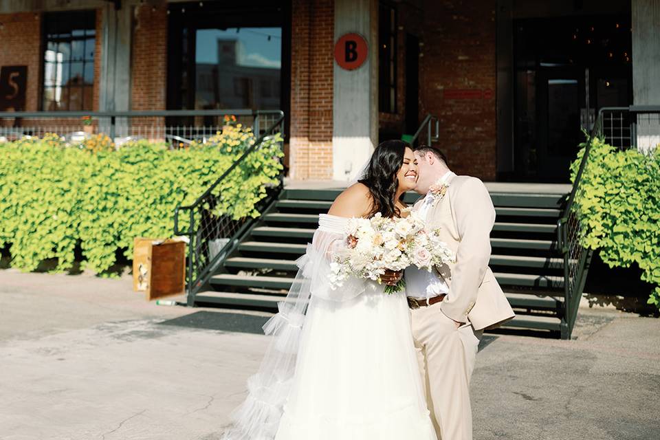 Kissing by the front steps