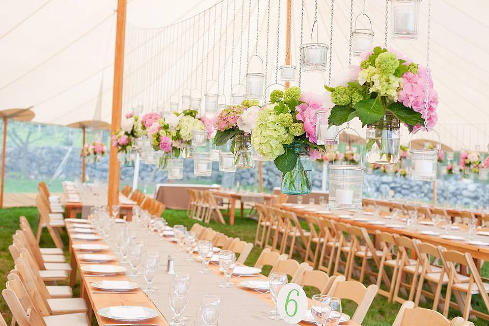 Long tables and hanging floral decor