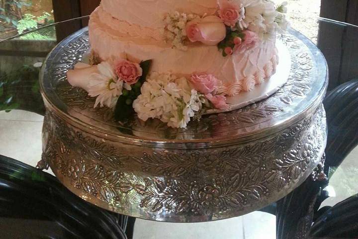 Alternating tiers of Homemade Strawberry Pound Cake and Homemade Cream Cheese Pound Cake iced with Creamy Buttercream Frosting