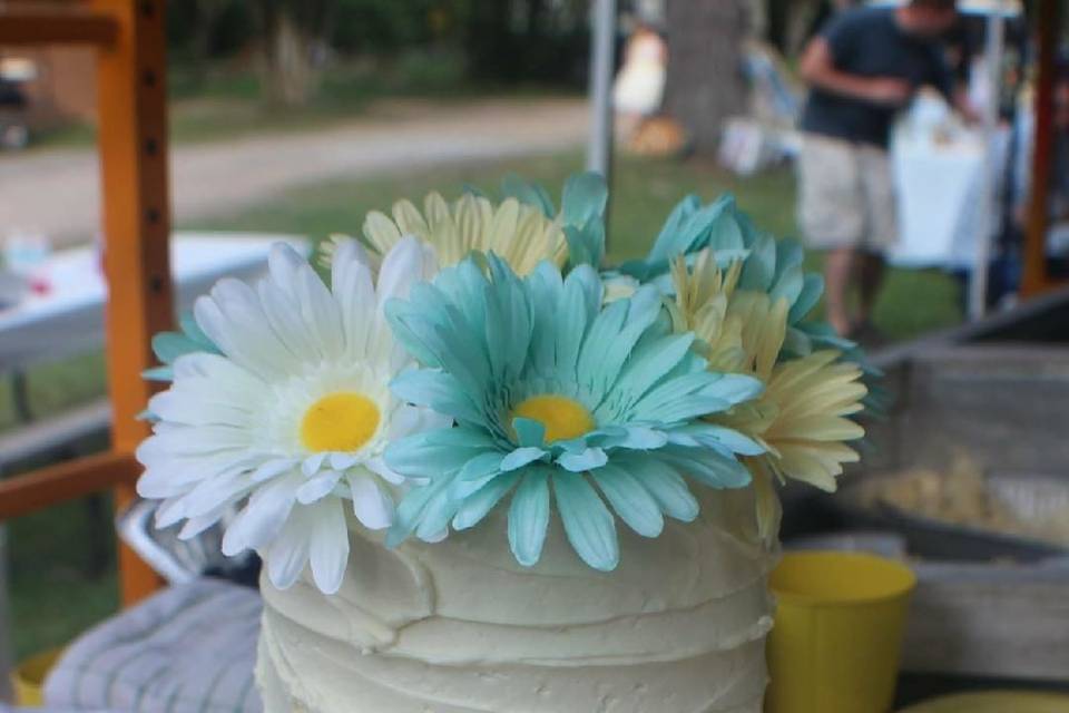 Two tier cake with flowers on top