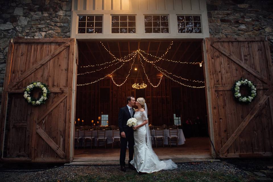 Kiss by the barn entrance