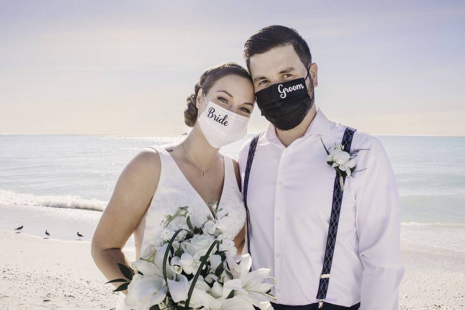 Bride and groom with masks