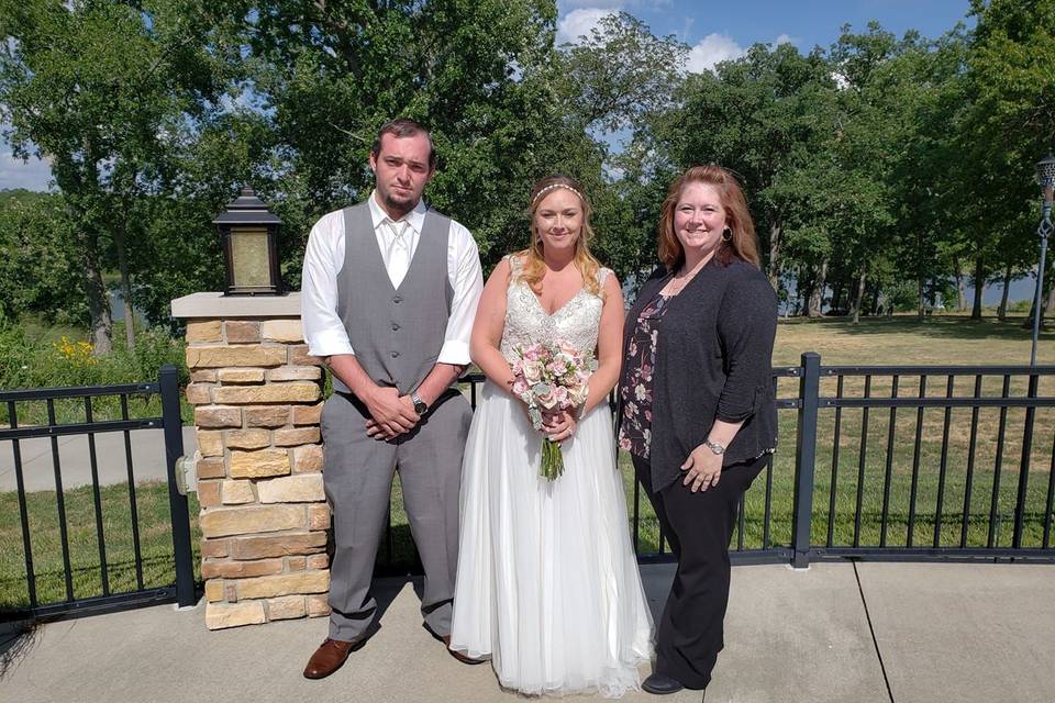 The newlyweds and the officiant