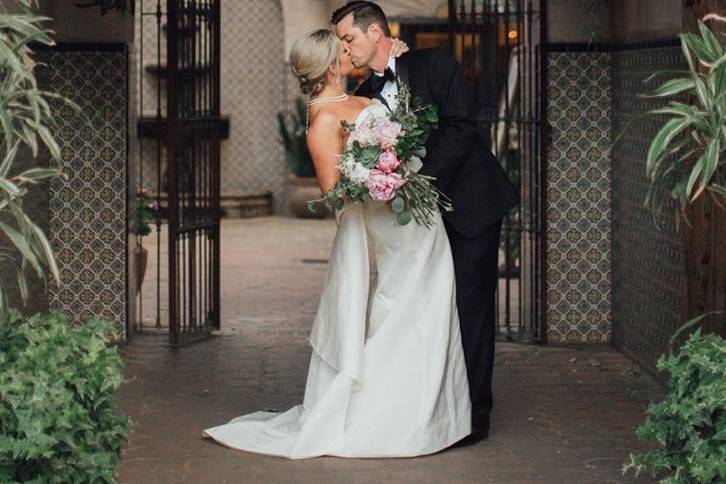 Groom kissing his bride