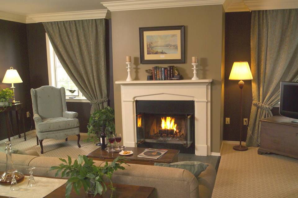 The sitting area in one of our Courtyard rooms which include a gas fireplace.