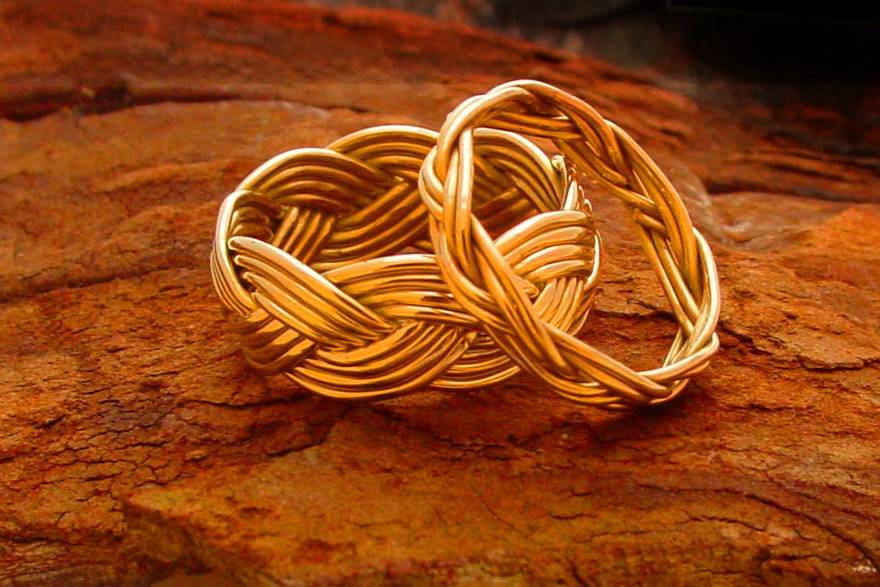 One of our classics that has a timeless look and appeal, the Turkshead Ring, also known as St. Croix's wedding bands.
These bands are handwoven from a single strand of gold or silver metal. All designs are made from recycled and Eco-friendly sources