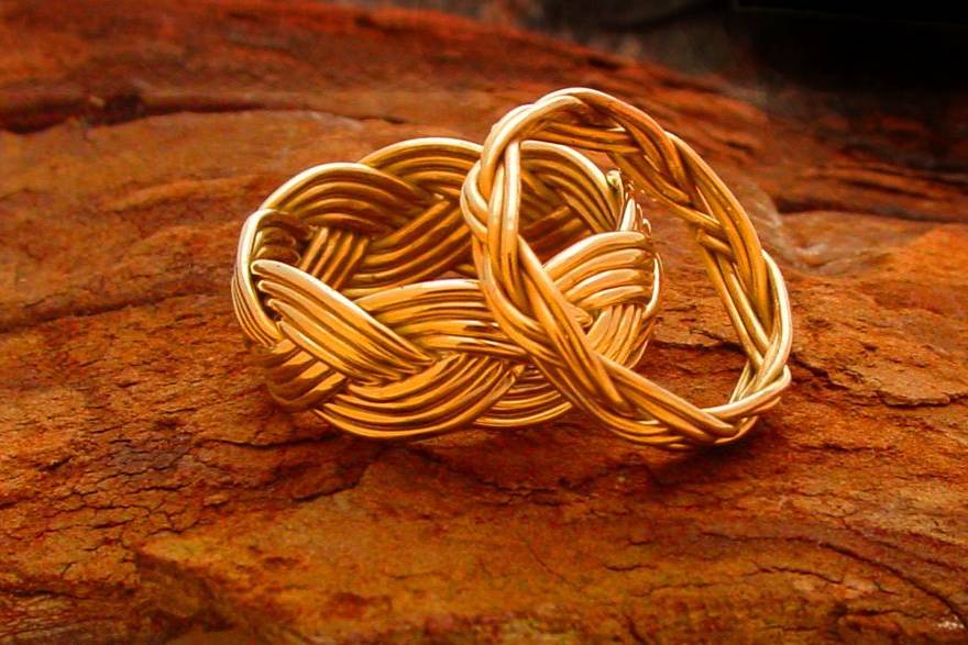 Crucian Knot cord bracelets (from top to bottom) Brass, Copper, and Silver. These cord bracelets adjust to any size your party guest might need.