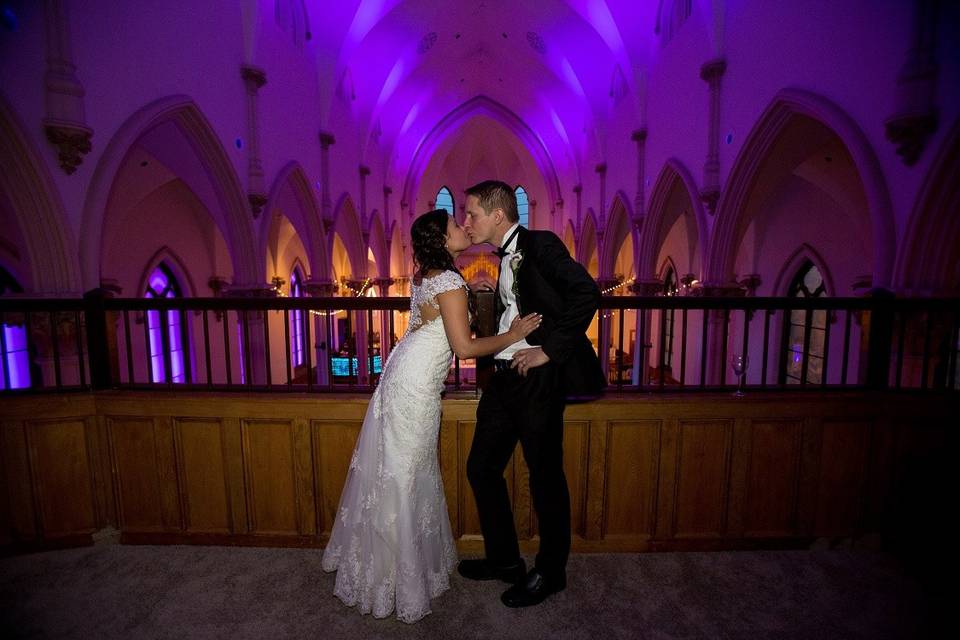 Sharing a kiss on the balcony