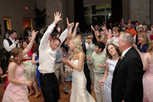 Dancing couple and guests