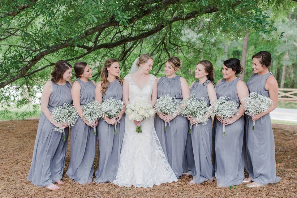 White rose bridal bouquet with baby's breath bridesmaids bouquets | Photo courtesy of Kathryn Ivy Photography