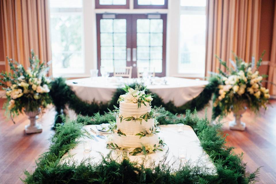 Sweetheart table and cake floral | Photo courtesy of Tim Tab Studios