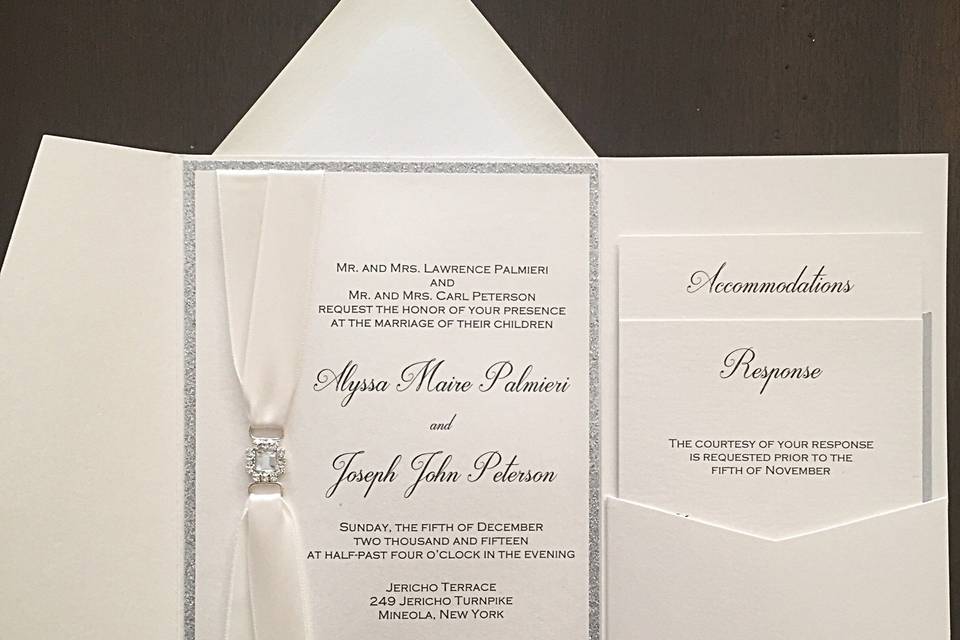 White invitation with ribbon