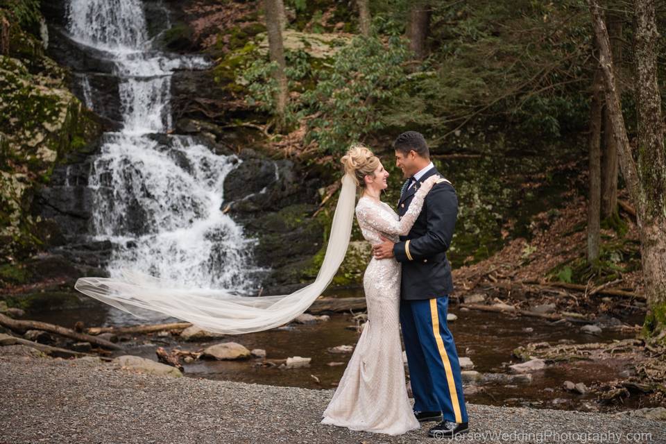 Bride, groom, and waterfall