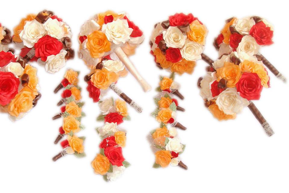 These lovely bouquets use handmade coffee filter paper Roses in orange, ivory and red colors and brown satin wired ribbon. Each flower petal is hand cut, individually painted, hung to dry, assembled and shaped to create the perfect realistic looking Rose. The handle is wrapped in brown satin ribbon and ivory lace.