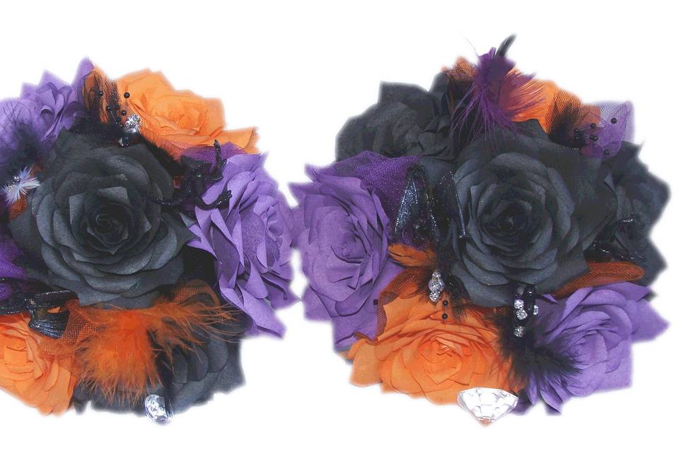 These bouquets are made of orange, purple and black paper coffee filter Roses. Each flower petal is hand cut, individually painted, hung to dry, assembled and shaped to create the perfect Rose. Between the flowers are delicate pearl sprays, shimmering black tulle, feathers, rhinestones and super cool black glitter dragons. The stems are wrapped in black satin ribbon with rows of sheer orange ribbon around the top and bottom for extra color.