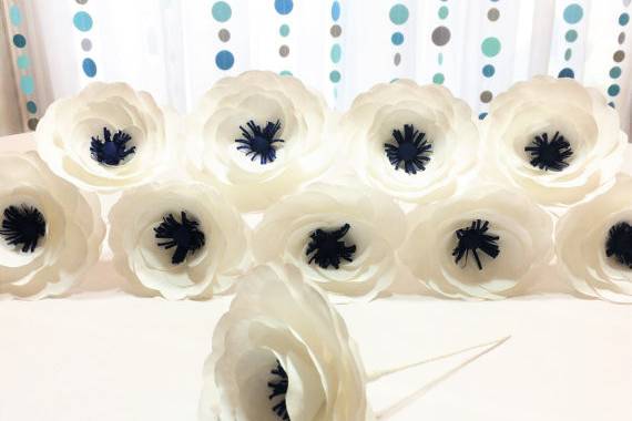Paper coffee filter Anemone made in colors of your choice. Flowers are made with a crepe paper stamens in the center. Flowers have a wire stem wrapped in white floral tape. These can be made without stem upon request. Please contact us for custom colors.