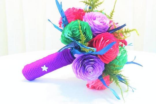 There are red, purple and green handmade paper filter Peonies, mossy leaves and red and blue dried flowers and accents making up this unique Bridal bouquet. The handle is wrapped in silky purple rope with decorative stars and a beautiful silver rhinestone starfish. Can be made in colors of your choice.