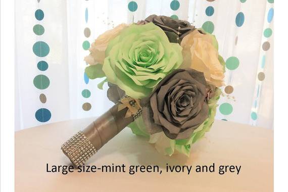 Elegant handmade filter paper roses in mint green, ivory and grey. Can be made in colors and size of your choice. Mixed in the flowers are grey satin ribbon Roses, delicate pearl sprays and shimmering ivory tulle. The stems are wrapped in grey satin ribbon with rows of silver rhinestone mesh ribbon around the top and bottom for extra sparkle.