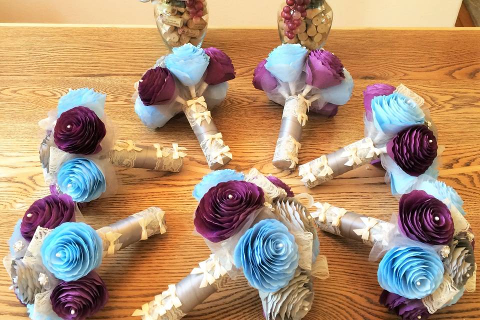 Wedding party bouquets and centerpieces in plum, grey and powder blue.