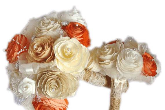 Rustic gold, ivory, white, champagne and orange handmade filter paper Peony flowers. Each Peony has a pearl in the center. Mixed in are pearl sprays, pearl and rhinestone stems, lace, ribbon, tiny foam and organza roses and waves of tulle. The handle is wrapped in burlap and ivory lace