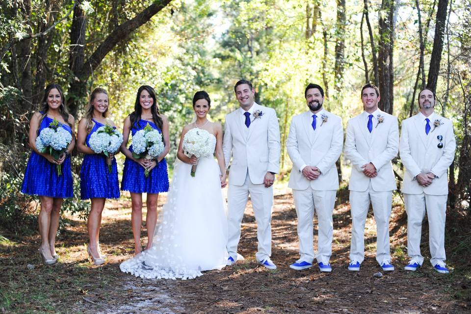 The couple with the bridesmaids and groomsmen