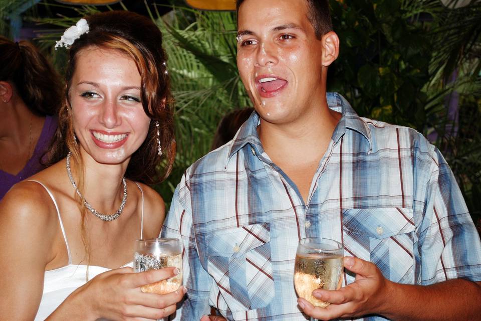 Looks like he didn't get all that cake off his face.  Such an enjoyable relaxed young couple.