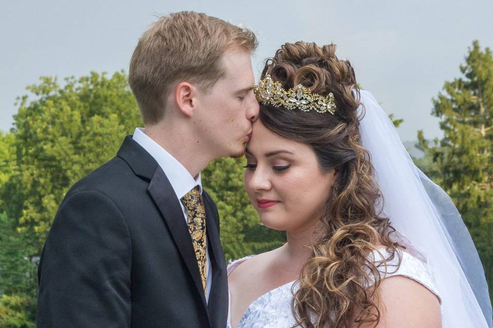Groom kissing Bride Forehead