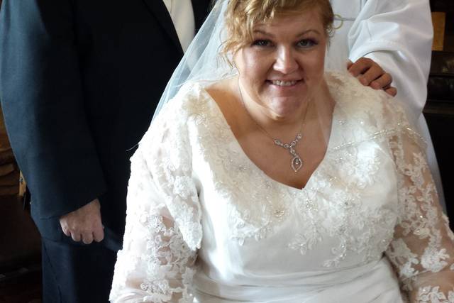 The newlyweds with the officiant