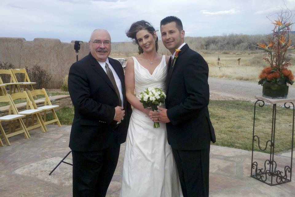 Newlyweds with the officiant