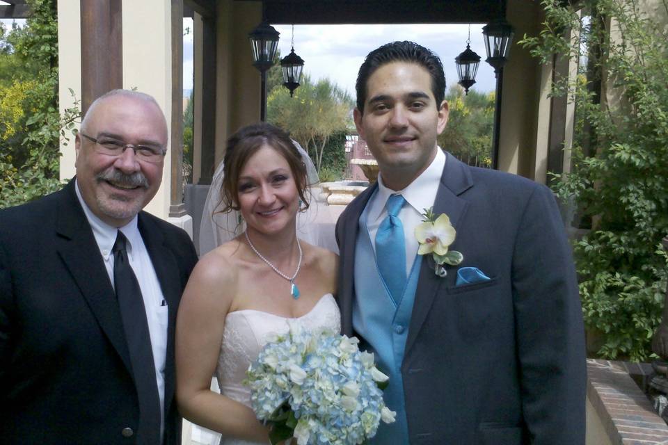 Couple with the officiant