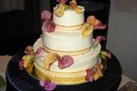 Live orchids make the cake appear to fly away! Your choice flowers and ribbons.