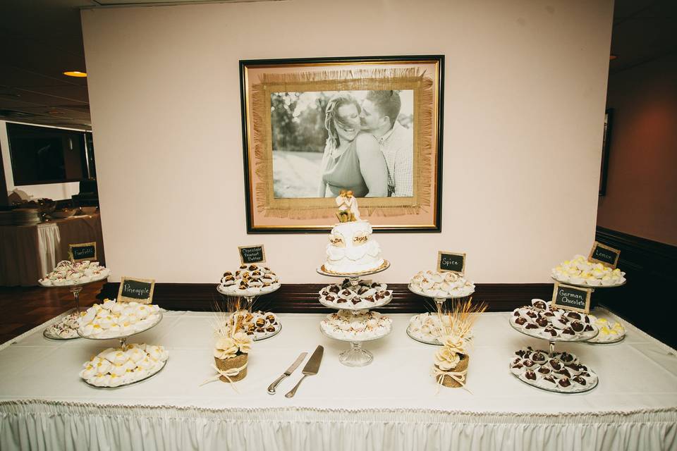 Wedding cake and cupcakes station