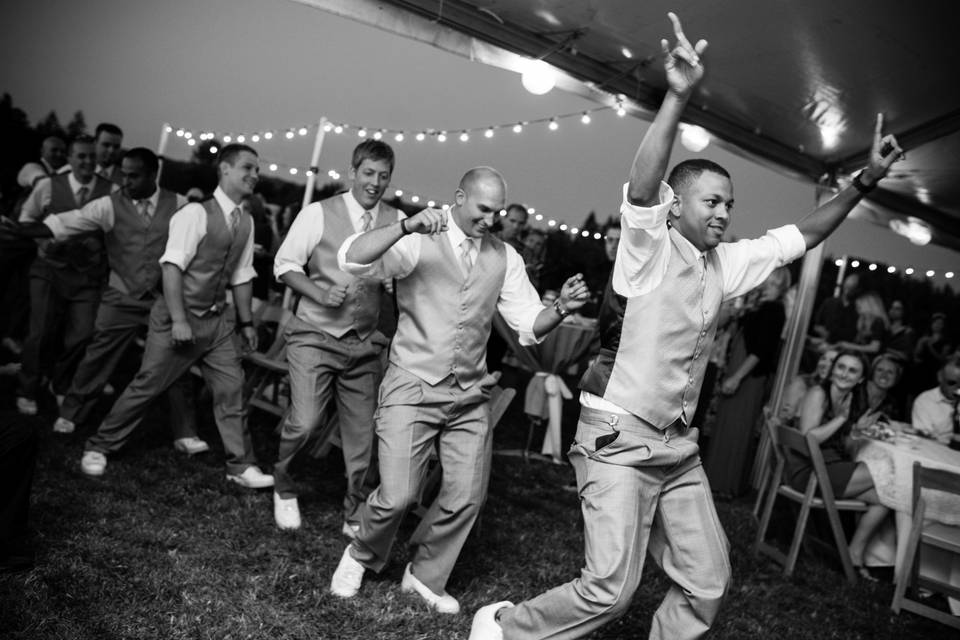 Photo by Powers Photography Studios.
Groomsmen make an entrance to get the party started!
Oregon Rustic Country Orchard Wedding.