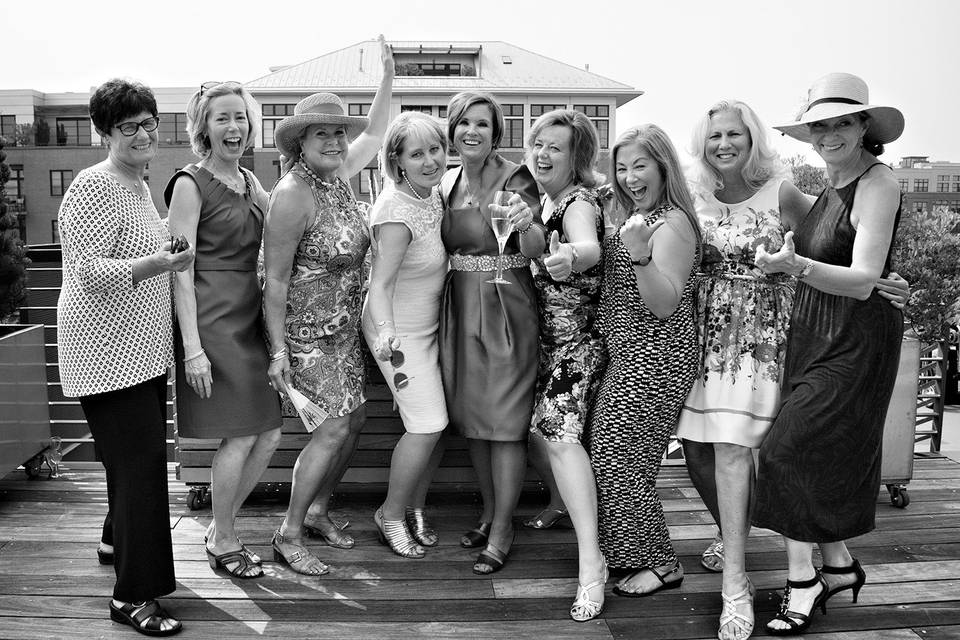 The ladies at this reception know how to have fun! Champagne flowed all afternoon on this hot August day in NW Portland. 2015 LGBTQ rooftop terrace wedding reception. Photography by Jamie Bosworth Studio.